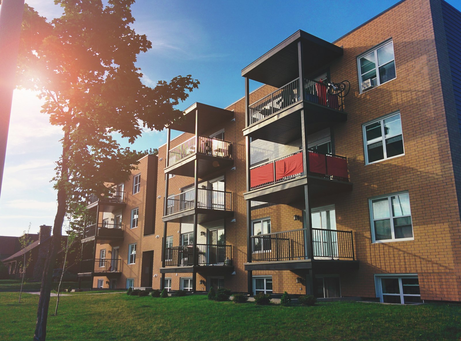Garden-style apartment community in afternoon light